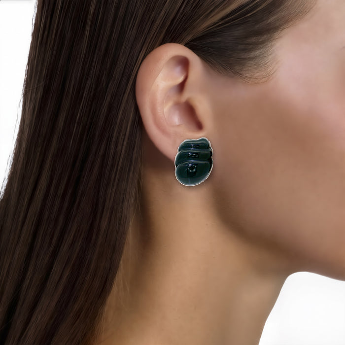 Vintage Onyx Clip-On Earrings in 14k Yellow Gold shown on the ear (medium skin tone)
