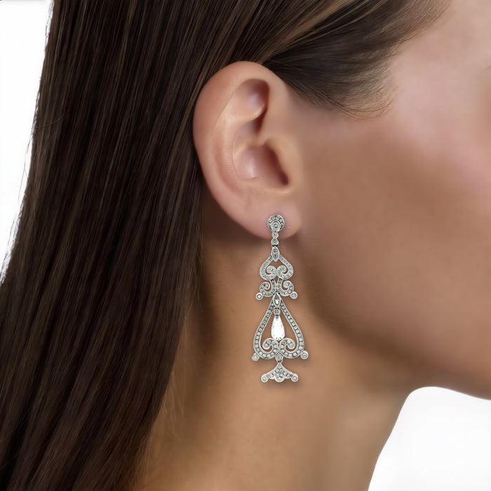 Nearly Flawless Colorless Diamond Chandelier Earrings (3 ct. tw.) in 18k White Gold shown on the ear (medium skin tone)