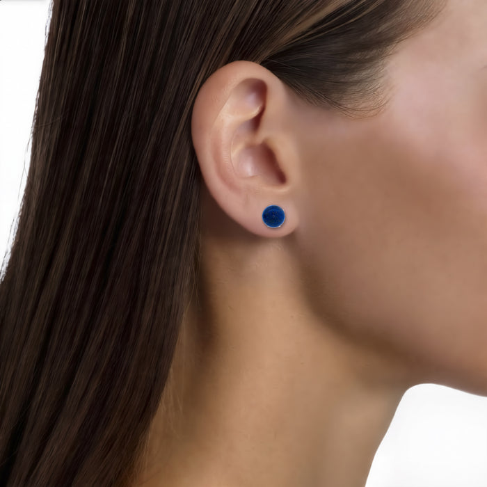Blue Lapis Lazuli Stud Earrings (8mm) in 18k Yellow Gold shown on the ear (medium skin tone)