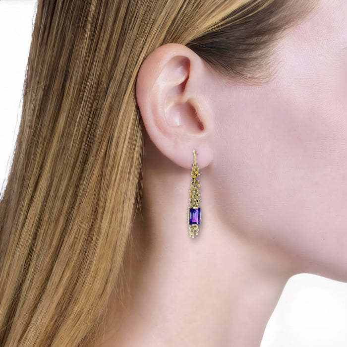 Emerald-Cut Vivid Amethyst Dangle Earrings (1 ct. tw.) in 14k Yellow Gold shown on the ear (light skin tone)