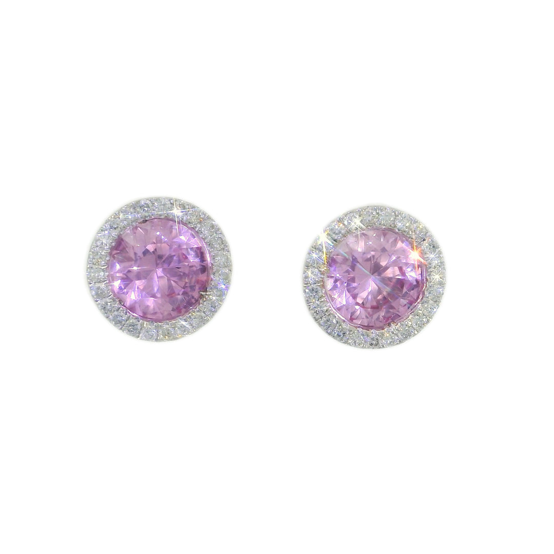 A pair of round pink tourmaline gemstone earrings with halo diamond accents, set in white gold.