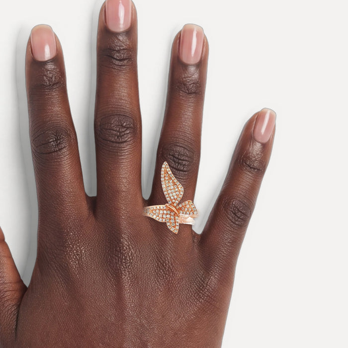 Pavé Diamond Butterfly Ring (⅓ ct. tw.) in 14k Rose Gold shown on a hand (deep skin tone)