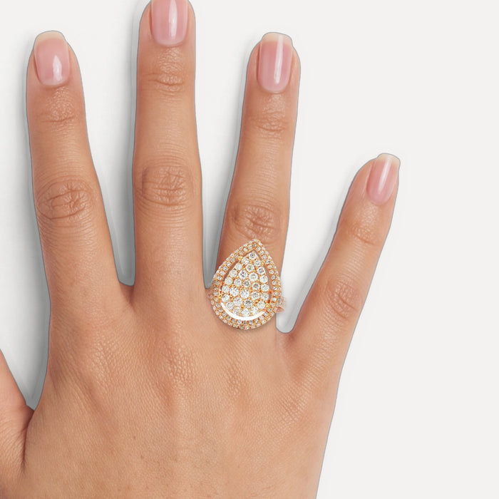 Pear-Shaped Nearly Flawless Colorless Diamond Cluster Ring (1 ¼ ct. tw.) in 18k Rose Gold shown on a hand (medium skin tone)