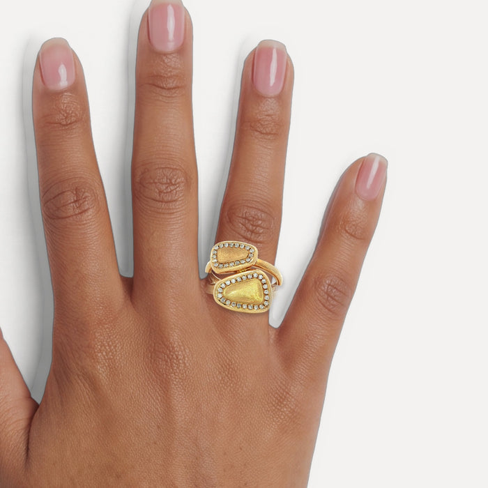 Round Brilliant Cut Near-Colorless Diamond "Toi et Moi" Split Shank Bypass Ring (¼ ct.) in 14k Yellow Gold shown on a hand (medium deep skin tone)
