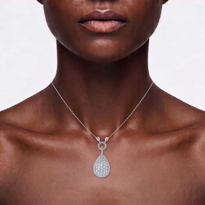 Teardrop Colorless & Nearly Flawless Diamond Cluster Pendant Necklace (3 ½ ct. tw.) in 14k White Gold shown on the neck (deep skin tone)