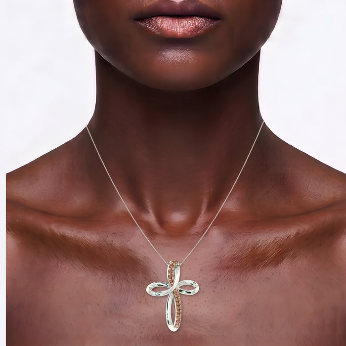 Pavé Cognac Cubic Zirconia Infinity Cross Pendant Necklace in Sterling Silver shown on the neck (deep skin tone)