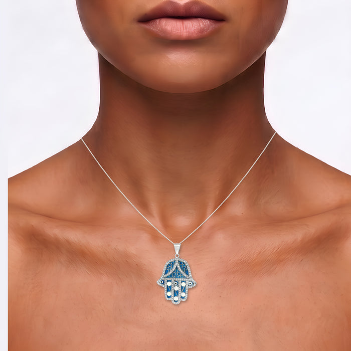 Hand of Hamsa Adjustable Length Pendant Necklace in Sterling Silver shown on the neck (medium deep skin tone)