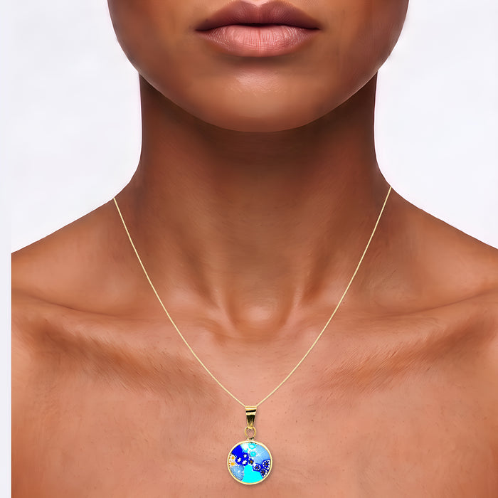 Italian Murano Millefiori Glass Pendant Necklace in 18k Yellow Gold shown on the neck (medium deep skin tone)