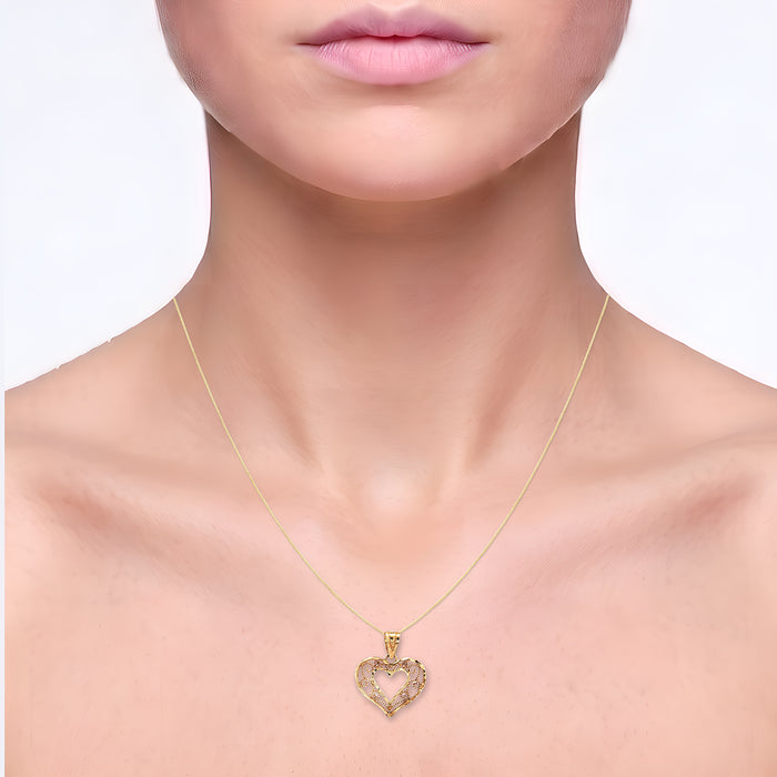 Vintage Open Filigree Solid Gold Heart Pendant Necklace in 14k Yellow Gold shown on the neck (light skin tone)
