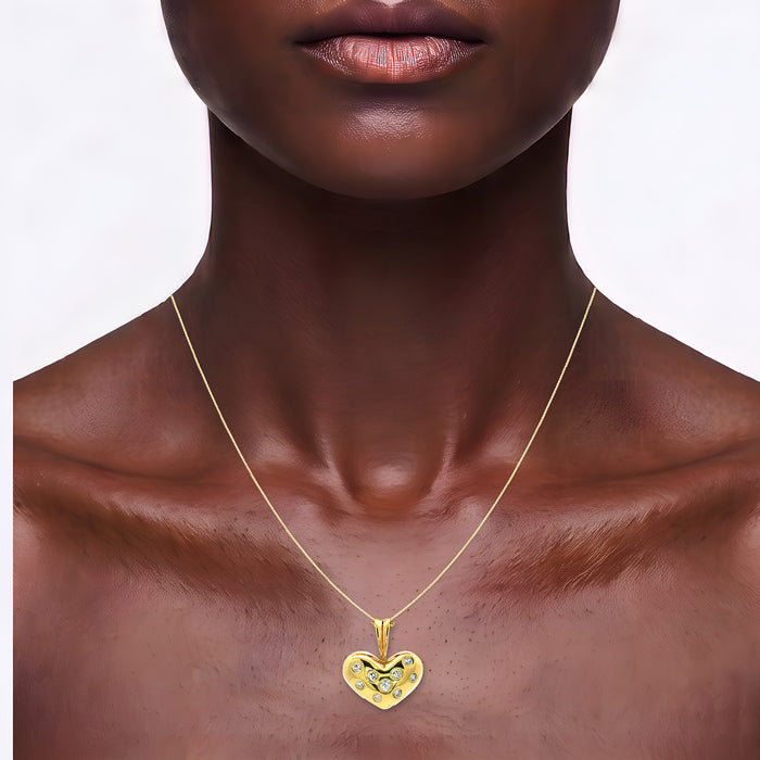 Bezel-Set Colorless Nearly Flawless Diamond Heart Pendant Necklace (⅗ ct. tw.) in 18k Yellow Gold shown on the neck (deep skin tone)