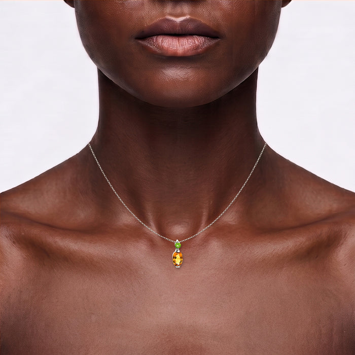 Oval Vivid Citrine & Peridot Pendant Necklace (2 ct. tw.) in 14k White Gold shown on the neck (deep skin tone)