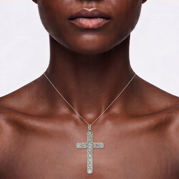 Colorless Nearly Flawless Diamond Cross Pendant Necklace (1 ⅞ ct. tw.) in 14k White Gold shown on the neck (deep skin tone)