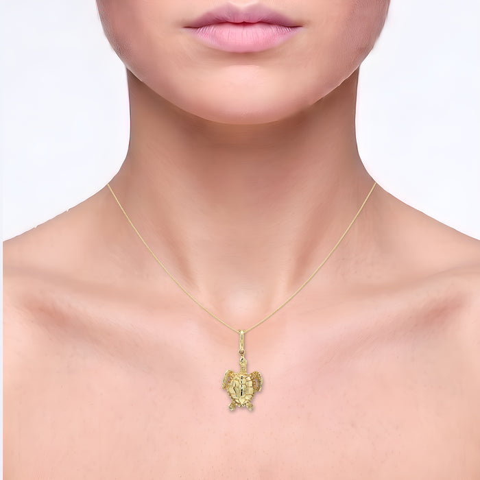 Sea Turtle Pendant Necklace in Solid 14k Yellow Gold shown on the neck (light skin tone)