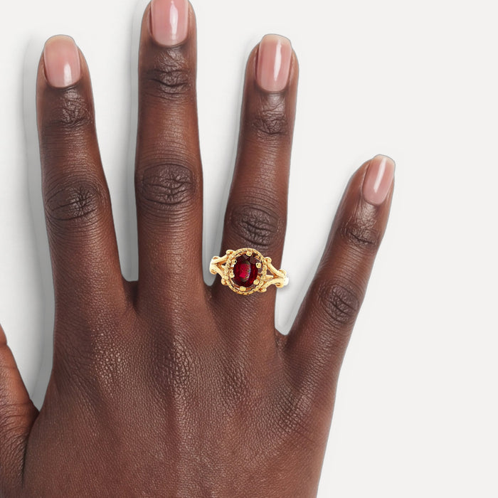 Antique Victorian Oval Deep Ruby Ring (1 ⅙ ct.) in 14k Yellow Gold shown on a hand (deep skin tone)
