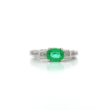 Oval Cut Emerald & Pavé Diamond Ring (1 ⅓ ct. tw.) in 18k White Gold