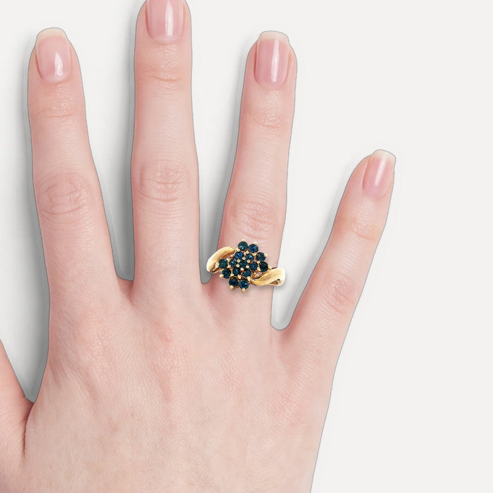 Round Brilliant Cut Deep Vivid Blue Sapphire Ring (1 ½ ct.) in 10k Yellow Gold shown on a hand (light skin tone)