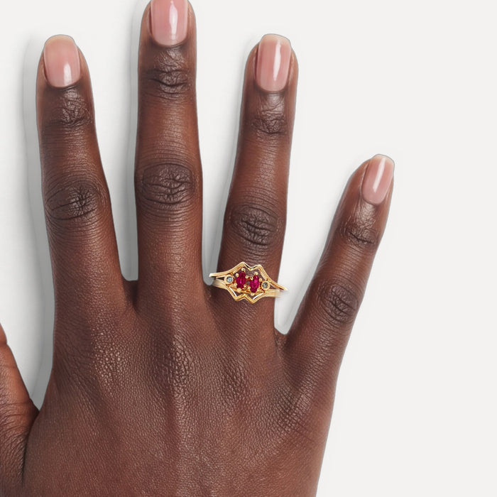 Vintage Marquise Brilliant Cut Ruby & Round Brilliant Cut Diamond Bypass Ring in 14k Yellow Gold shown on a hand (deep skin tone)