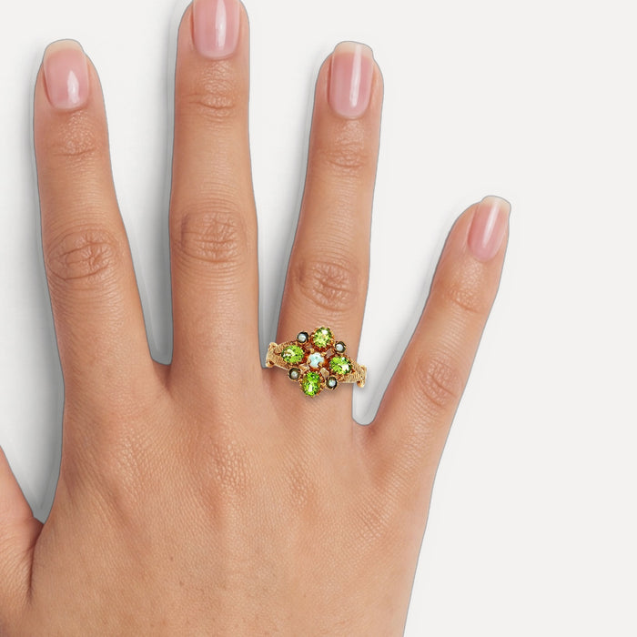 Antique Edwardian Oval Vivid Peridot Pearl Flower Cluster Ring (1 ct. tw.) in 9k Yellow Gold shown on a hand (medium skin tone)