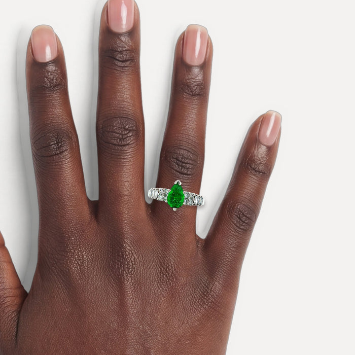Pear Shape Emerald & Near-Colorless Round Brilliant Cut & Baguette Diamond Ring (1 ¾ ct. tw.) in 18k White Gold shown on a hand (deep skin tone)
