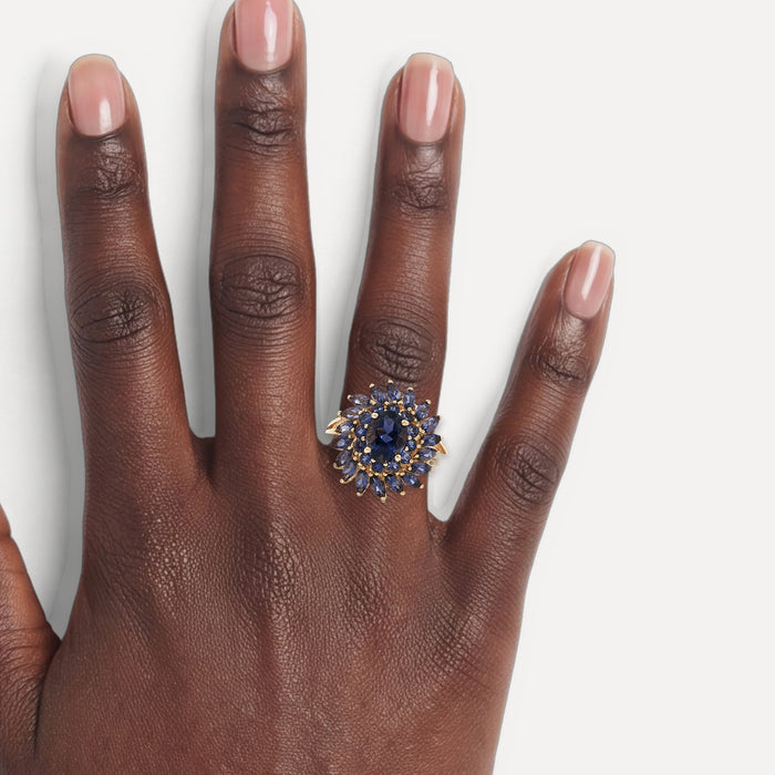 Iolite Sunburst Ring (2 ¾ ct.) in 10k Yellow Gold with Oval Brilliant Cut, Round Brilliant Cut, & Marquise Brilliant Cut Iolite shown on a hand (deep skin tone)