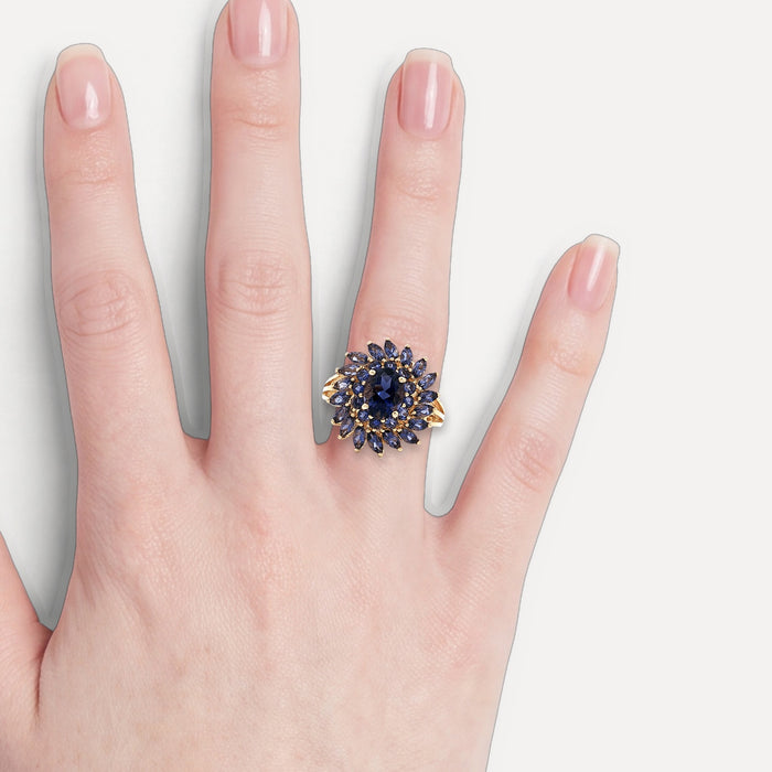 Iolite Sunburst Ring (2 ¾ ct.) in 10k Yellow Gold with Oval Brilliant Cut, Round Brilliant Cut, & Marquise Brilliant Cut Iolite shown on a hand (light skin tone)