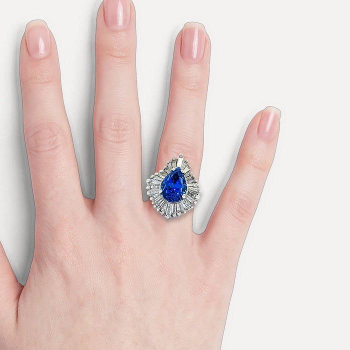 GIA Certified Pear Sapphire Colorless Diamond Ballerina Ring (7 ⅓ ct. tw.) in 14k White Gold shown on a hand (light skin tone)