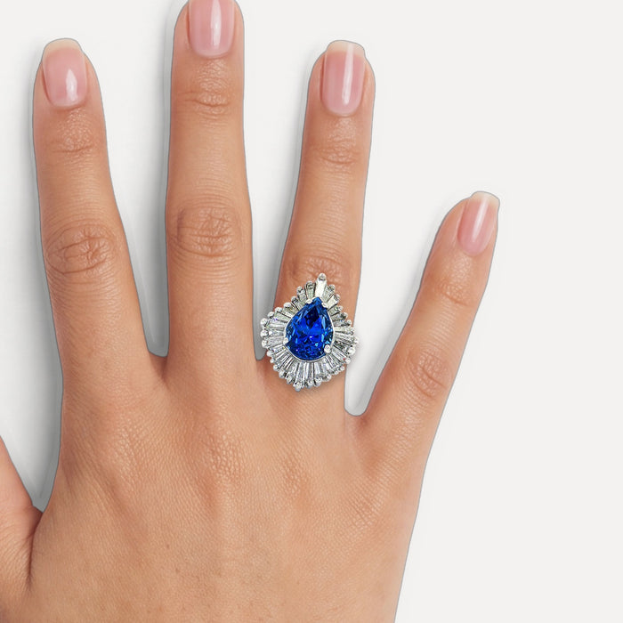 GIA Certified Pear Sapphire Colorless Diamond Ballerina Ring (7 ⅓ ct. tw.) in 14k White Gold shown on a hand (medium skin tone)
