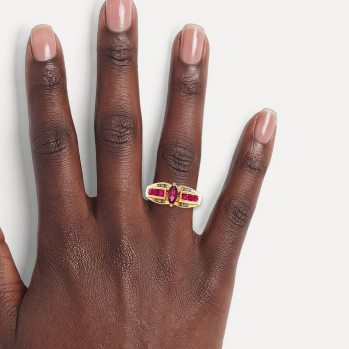 Marquise Ruby & Round Brilliant Cut Near-Colorless Diamond Ring (⅞ ct. tw.) in 14k Yellow Gold shown on a hand (deep skin tone)