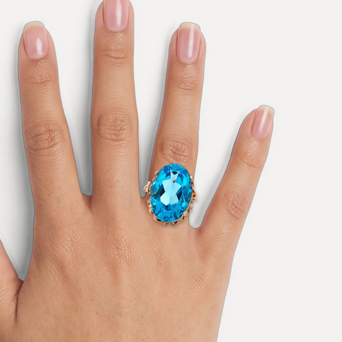 Vintage Oval-Shaped London Blue Topaz Ring (17 ct.) in 14k Rose Gold shown on a hand (medium skin tone)
