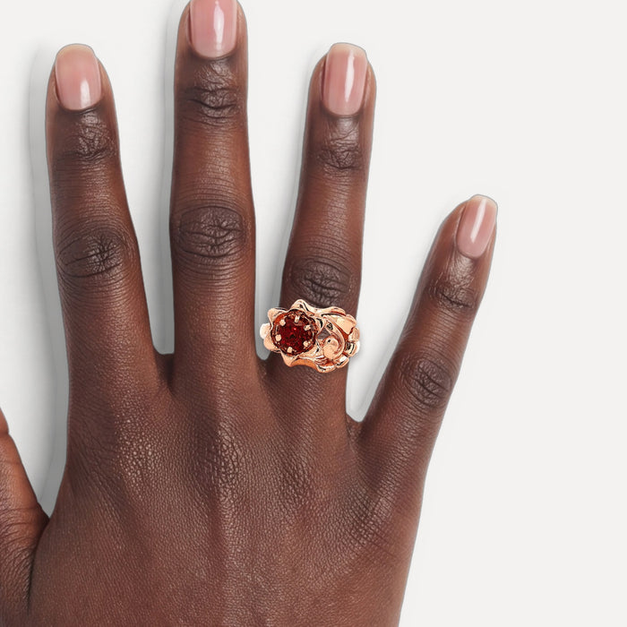 Mid-Century Round Brilliant Vintage Garnet Cocktail Ring (⅔ ct.) in 14k Rose Gold shown on a hand (deep skin tone)