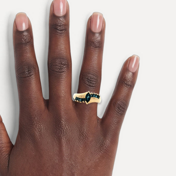 Marquise Deep Blue Sapphire Ring (1 ct. tw.) in 10k Yellow Gold shown on a hand (deep skin tone)