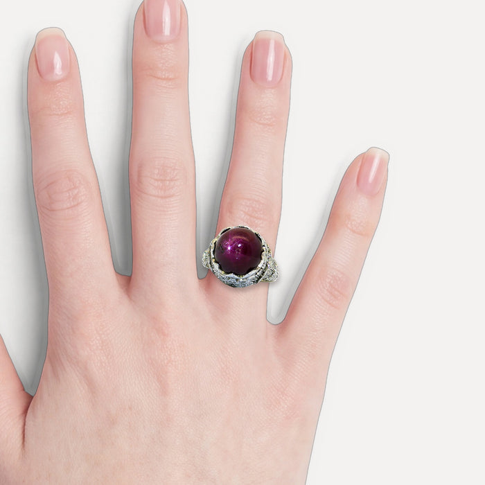 GIA Certified Antique Edwardian Deep Unheated Star Ruby Colorless Nearly Flawless Diamond Ring (20 ct. tw.) in Platinum shown on a hand (light skin tone)