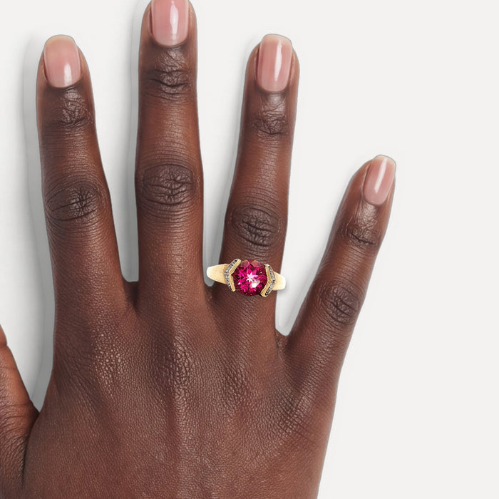 Vivid Deep Pink Spinel & Diamond Ring (2 ⅓ ct. tw.) in 10k Yellow Gold shown on a hand (deep skin tone)