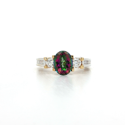 Oval-shaped Mystic Topaz and colorless near-flawless diamond ring in 18k white and yellow gold.