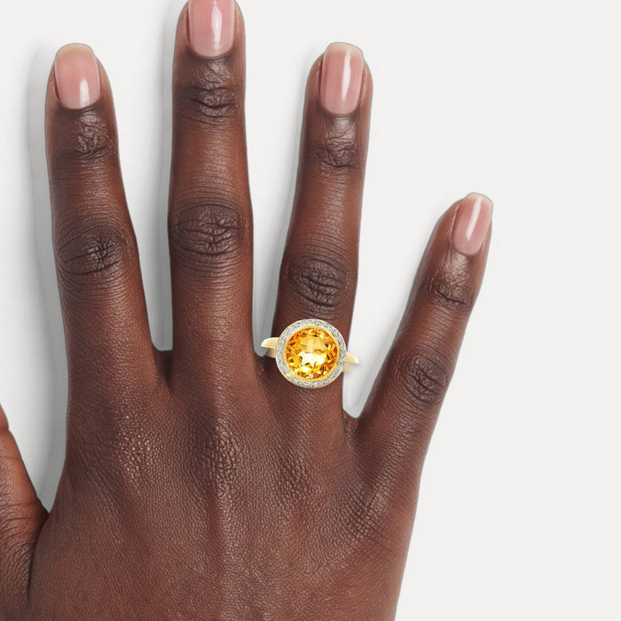 Rich Honey-Amber Citrine & Diamond Halo Ring (3 ⅔ ct. tw.) in 18k Yellow Gold shown on a hand (deep skin tone)