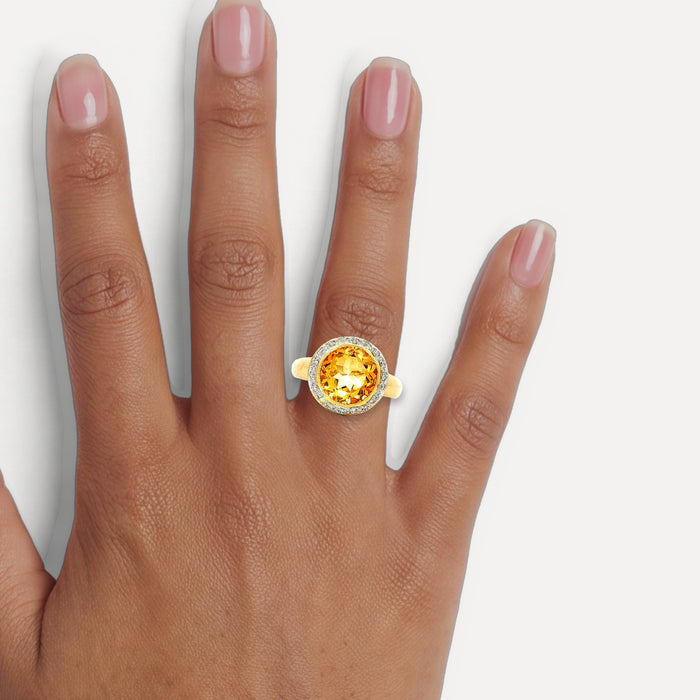 Rich Honey-Amber Citrine & Diamond Halo Ring (3 ⅔ ct. tw.) in 18k Yellow Gold shown on a hand (medium deep skin tone)