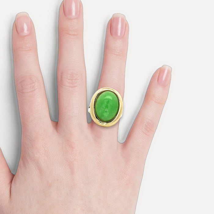 Oval Cabochon Jade Bezel-Set Ring (8 ⅓ ct.) in 14k Yellow Gold shown on a hand (light skin tone)