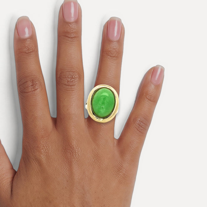 Oval Cabochon Jade Bezel-Set Ring (8 ⅓ ct.) in 14k Yellow Gold shown on a hand (medium deep skin tone)