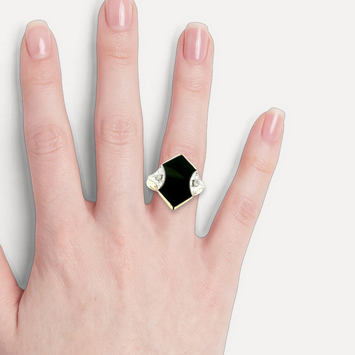 Vintage Onyx & Diamond Art Deco Shield Ring in 14k Yellow Gold shown on a hand (light skin tone)