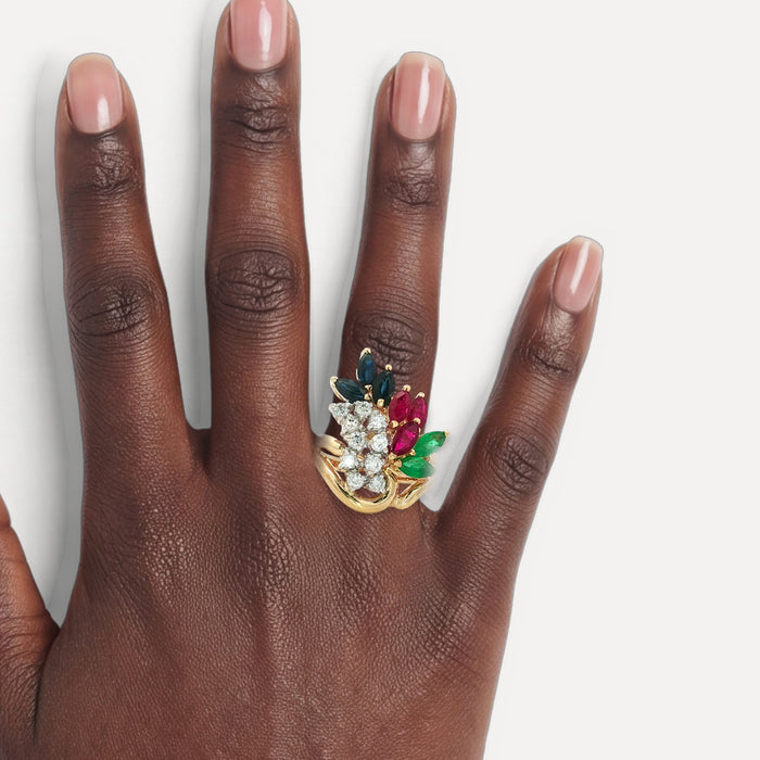 Birds of Paradise Diamond, Ruby, Sapphire & Emerald Ring (3 ⅒ ct. tw.) in 14k Yellow Gold shown on a hand (deep skin tone)