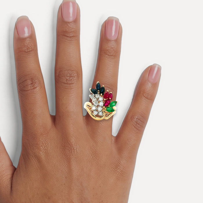 Birds of Paradise Diamond, Ruby, Sapphire & Emerald Ring (3 ⅒ ct. tw.) in 14k Yellow Gold shown on a hand (medium deep skin tone)