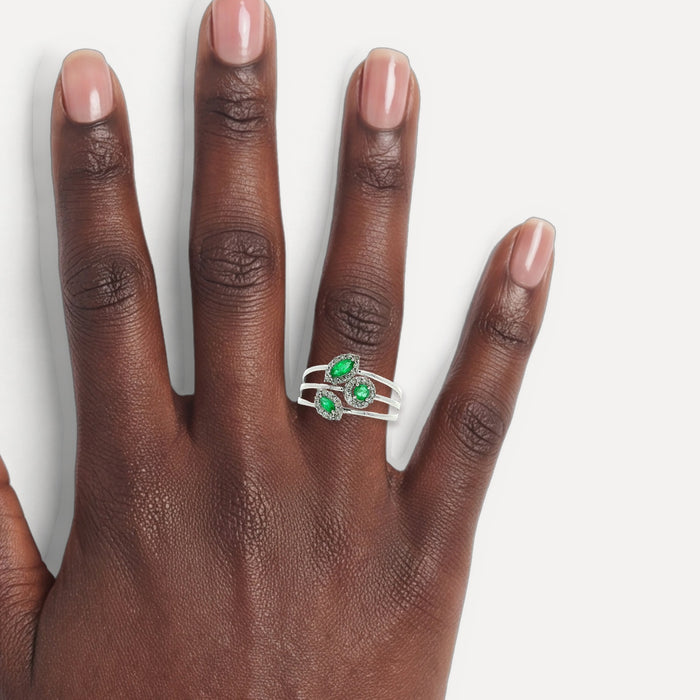 Emerald & Near Colorless Halo Diamond Triple Split Shank Ring (⅗ ct. tw.) in 14k White Gold shown on a hand (deep skin tone)