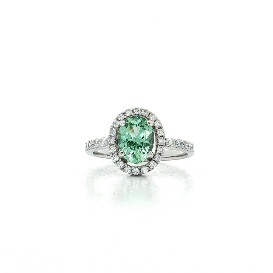 Oval Green Demantoid Garnet Diamond Ring in 18k White Gold with Diamond Halo, showcasing vibrant color.