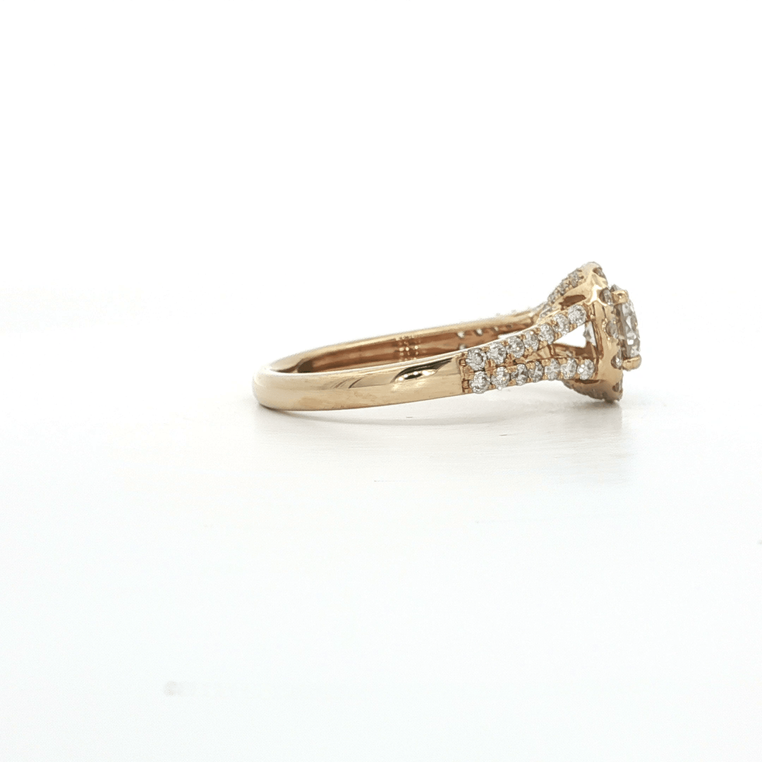 Gold engagement ring with pavé diamonds on band and setting, white background.