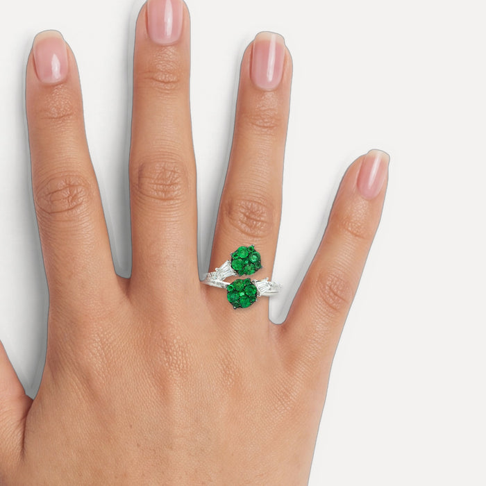 Emerald & Nearly Flawless Colorless Round Brilliant Cut & Baguette Diamond Bypass Ring (⅓ ct. tw.) in 14k White Gold shown on a hand (medium skin tone)