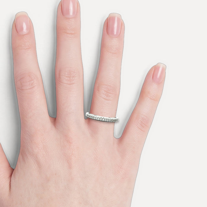 Round Brilliant Cut Diamond Wedding Band (⅙ ct.) in 18k White Gold shown on a hand (light skin tone)