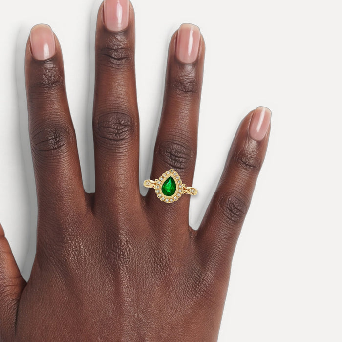 Pear Vivid Emerald & Diamond Halo Ring (1 ct. tw.) in 14k Yellow Gold shown on a hand (deep skin tone)