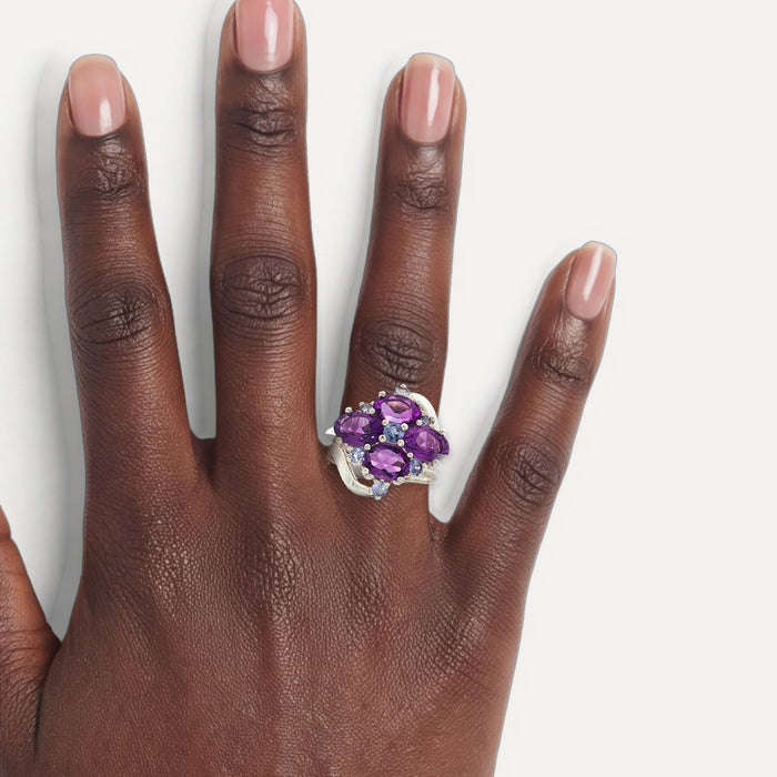 Purple & Sky Blue Split Shank CZ Ring in Sterling Silver shown on a hand (deep skin tone)