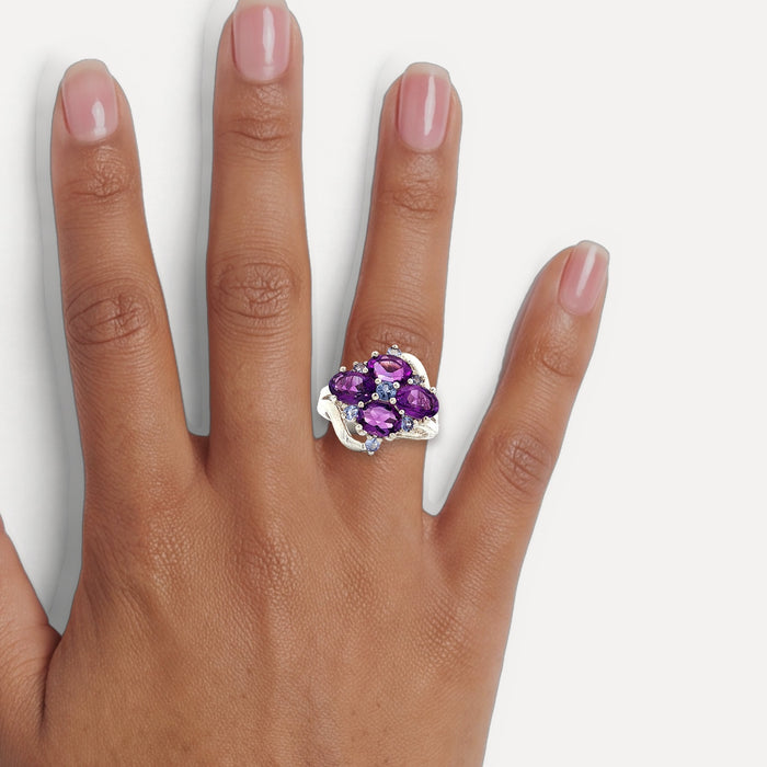 Purple & Sky Blue Split Shank CZ Ring in Sterling Silver shown on a hand (medium deep skin tone)