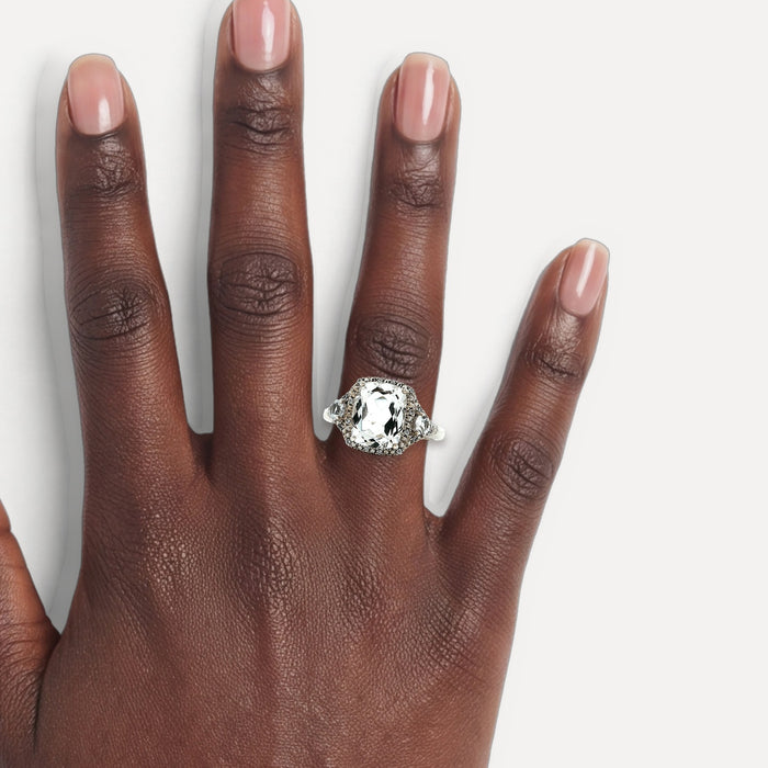 Cushion White Topaz Cubic Zirconia Halo Cocktail Ring (4 ¼ ct.) in Sterling Silver shown on a hand (deep skin tone)